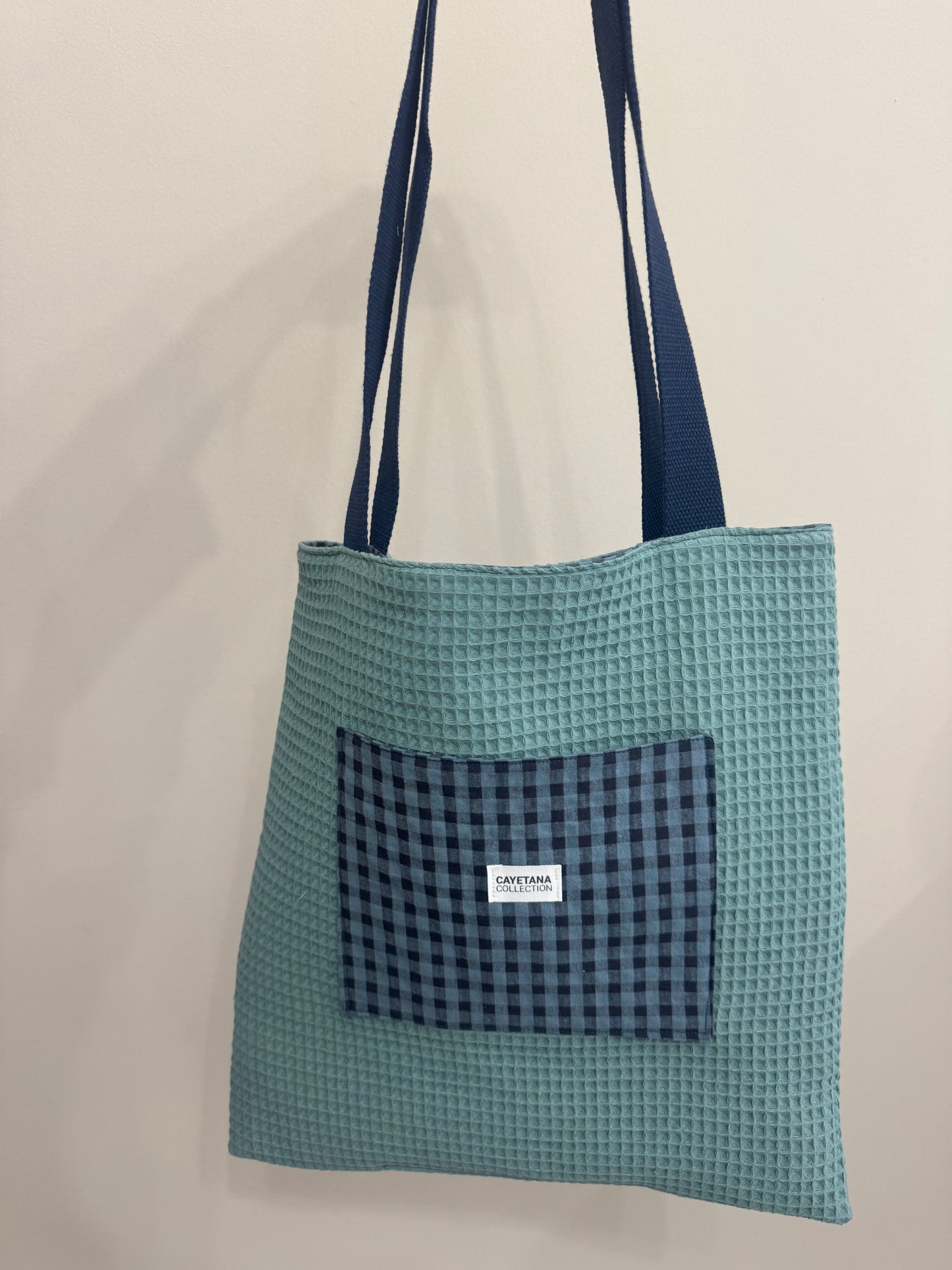 Bolsa reversible con bolsillo